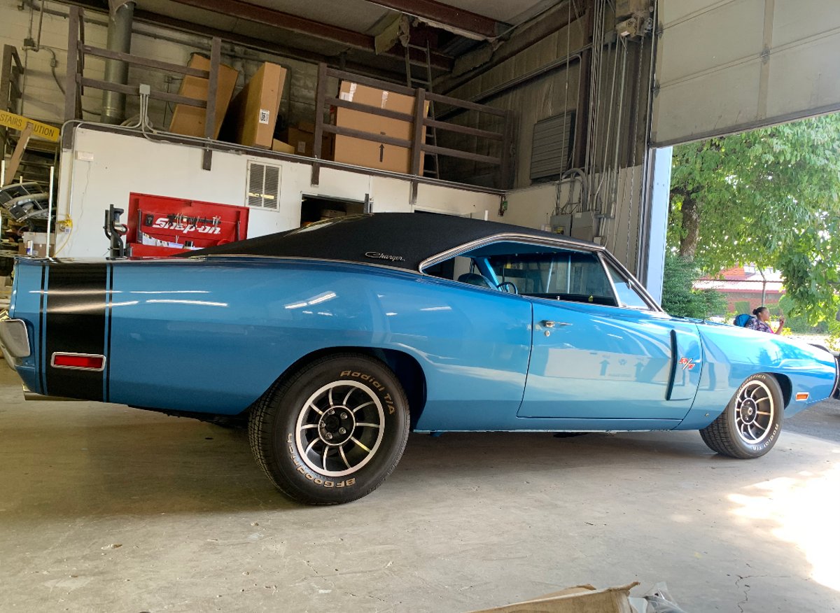 Restored blue classic car at the Gresham Collision Repair shop